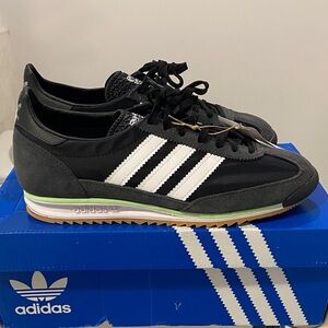Adidas Black and White Athletic Shoes with Green Trim